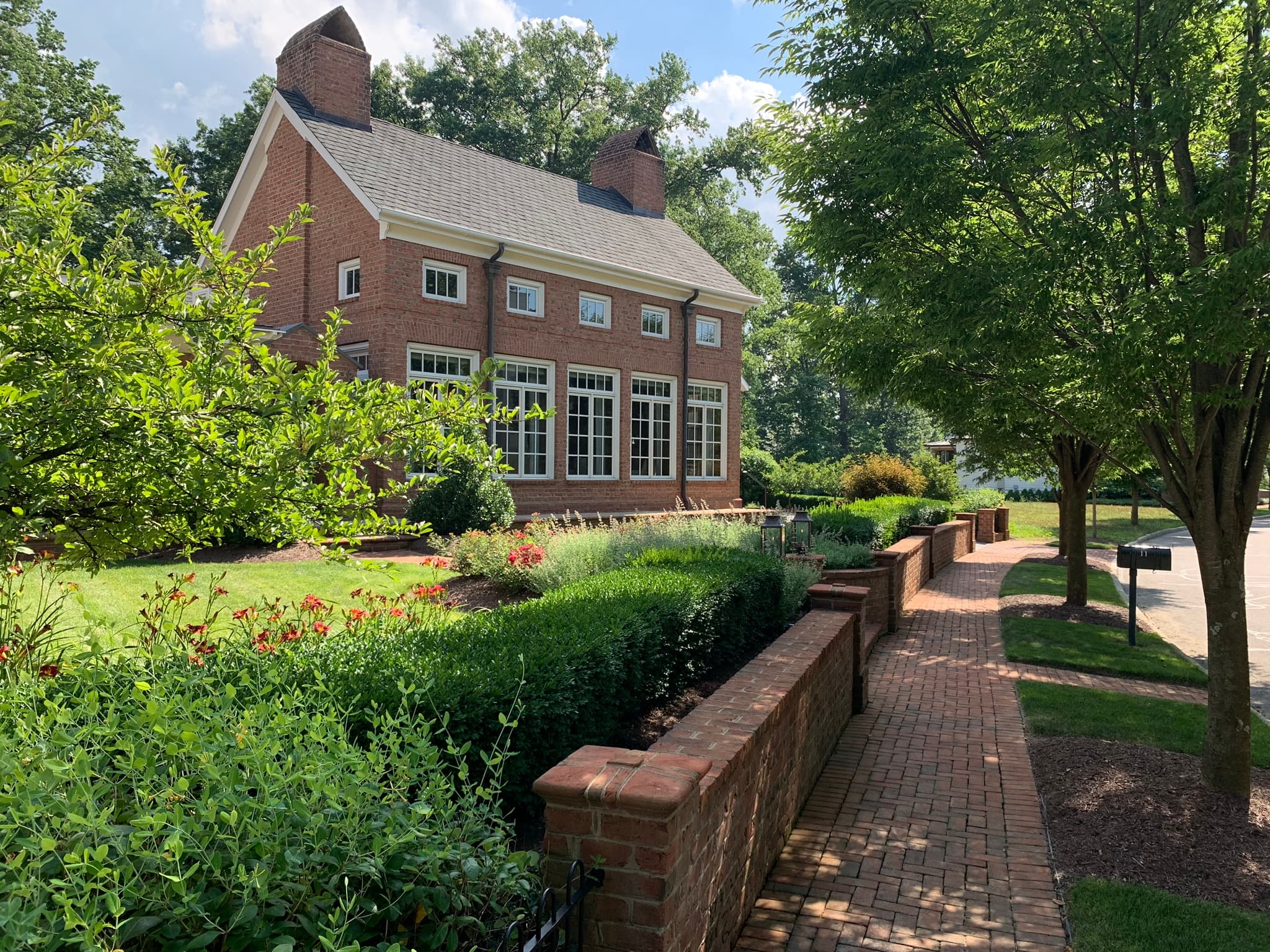 A red-brick Georgian home behind garden walls: the bigger next house a growing family moves up to